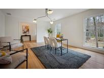 Bright office space with hardwood floors, modern lighting, and a view of the outdoors at 3226 Custer Lake Nw Dr, Marietta, GA 30064