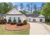 Charming single-story home with landscaped front yard and light blue shutters at 3187 Gainer Dr, Powder Springs, GA 30127