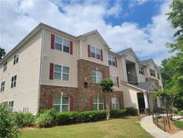 Inviting multi-level apartment building with manicured lawn and colorful window shutters at 1103 Waldrop Pl, Decatur, GA 30034