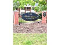 Welcoming entrance sign at The Columns at East Hill community with manicured lawn at 135 E Hill St # 12, Decatur, GA 30030