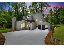 Striking modern home with a unique architectural design, pristine landscaping, and attached two car garage at 2934 Wendover St, Marietta, GA 30062