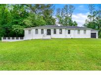 Charming home with a well-manicured lawn and inviting curb appeal at 4265 Hidden Valley Dr, South Fulton, GA 30349