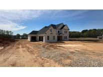 Stunning new construction featuring a two-story layout and attached two-car garage at 3284 Hall Rd, Dacula, GA 30019