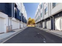 A view of the townhome garages, which are located on a shared driveway in a residential community at 1606 Rock Dam Dr # 11, Atlanta, GA 30317
