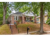 Charming brick home with a welcoming front porch and well-maintained yard at 540 Atwood Sw St, Atlanta, GA 30310