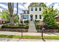 Beautifully landscaped home featuring a striking staircase leading to a classic white exterior at 797 Greenwood Ne Ave, Atlanta, GA 30306