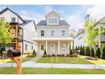 Attractive two-story home with a well-manicured lawn and inviting front porch at 2761 Mathews St, Smyrna, GA 30080