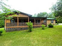 Charming home with a covered front porch and well-maintained lawn at 105 Doe Dr, Temple, GA 30179
