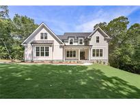 Beautifully landscaped new construction home with board and batten siding and large front yard at 6861 Ga Hwy 5, Douglasville, GA 30135