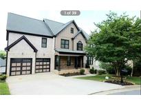 Beautiful two-story home with a manicured lawn and a two-car garage at 3306 Chastain Ridge Dr, Marietta, GA 30066
