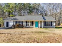 Charming single-story home featuring a bright blue front door and gray siding at 447 Wallace Way, Rockmart, GA 30153