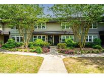 Charming townhome featuring well-maintained landscaping and a welcoming walkway at 331 Lakemoore Ne Dr # C, Atlanta, GA 30342