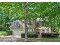 Charming two-story home with attached garage and mature landscaping at 745 Birchberry Sw Ter, Atlanta, GA 30331