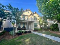 Charming two-story home with a welcoming front porch and landscaped front yard at 3219 Colchester St, Douglasville, GA 30135