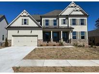 Charming two-story home featuring a two-car garage and beautifully landscaped front yard at 739 Marlay Sw Ln, Powder Springs, GA 30127