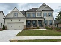 Beautiful two-story home with a two-car garage and well-manicured lawn at 739 Marlay Sw Ln, Powder Springs, GA 30127