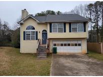 Charming two-story home featuring a two car garage and traditional architectural details at 1119 Oakwood Manor Ct, Decatur, GA 30032