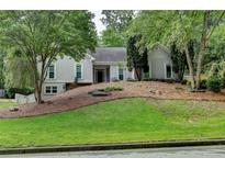 Charming home featuring manicured landscaping and a classic facade, creating inviting curb appeal at 3003 Heavenly Ln, Snellville, GA 30078