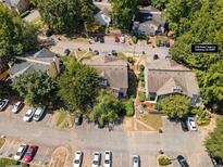 Overhead shot of the condo complex with ample parking and mature trees at 1106 Rock Creek Ln at 1106 Rock Creek Ln, Norcross, GA 30093