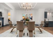 Bright dining room with modern chandelier, seating for six, and elegant decor at 190 Centennial Way, Atlanta, GA 30313