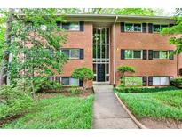 Charming brick apartment building with mature landscaping and well-maintained front lawn at 1111 Clairemont Ave # 5, Decatur, GA 30030