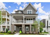 Charming two-story home features a welcoming porch and modern architectural details at 1419 Coretta Bnd, Atlanta, GA 30318