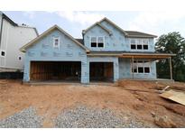 New construction showing a two-story home with an attached two-car garage at 214 Wild Ginger Bnd, Woodstock, GA 30188