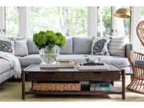 Comfortable living room featuring a plush sofa, coffee table with stylish decor and natural light, perfect for relaxation at 5205 Riverview Nw Rd, Atlanta, GA 30327