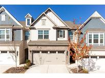 Charming two-story townhome with a brick facade and a two-car garage at 6348 Lanier Harbor Lndg, Buford, GA 30518