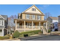 Charming two-story home features a welcoming front porch, well-maintained landscaping, and classic architectural details at 976 Arthur Nw Ln, Atlanta, GA 30318