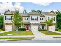 Charming townhomes with manicured lawns, stone accents, and individual driveways, located in a Gathering-friendly neighborhood at 692 Oakside Pl, Acworth, GA 30102