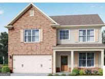 Charming two-story home featuring a brick facade, attached garage, and inviting front porch at 2081 Orchird Ln, Lithia Springs, GA 30122