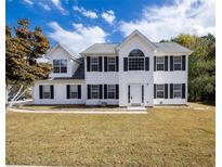 Charming two-story home with classic black shutters and a well-manicured lawn at 4230 Waldrop Hills Ter, Decatur, GA 30034