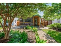 Charming home featuring a lush front yard with a brick walkway leading to a covered porch at 625 Kennesaw Ave, Atlanta, GA 30308
