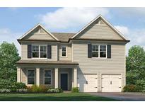 Charming two-story home featuring a symmetrical facade, double garage, and landscaped front yard at 115 Maplewood Ln, Conyers, GA 30094