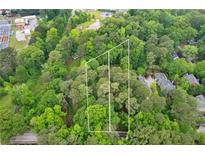 A tranquil aerial view showing boundaries of a wooded property at 1909 Moores Mill Nw Rd, Atlanta, GA 30318