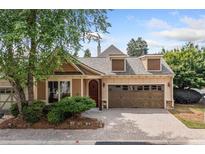 Charming home with a two-car garage and well-manicured landscaping at 620 Stickley Oak Way, Woodstock, GA 30189