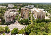 Stunning aerial view of luxurious high-rise buildings surrounded by lush greenery in a vibrant urban setting at 3286 Northside Nw Pkwy # 903, Atlanta, GA 30327