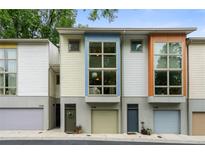 Modern townhome complex with large windows and colorful facade at 1346 Peter Haughton Nw Way, Atlanta, GA 30318