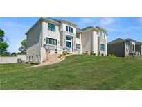 Stately two-story home with a manicured lawn and stone accents at 2989 Waterford Dr, Conyers, GA 30094