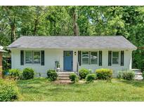 Charming ranch-style home with blue door, black shutters, and neat front lawn at 2210 Polar Rock Sw Ave, Atlanta, GA 30315