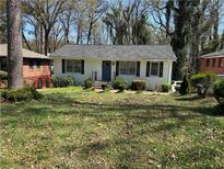 Charming single-story home featuring a well-maintained front yard and a classic, welcoming facade at 2210 Polar Rock Sw Ave, Atlanta, GA 30315