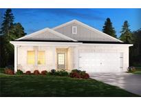 Charming single-story home with white brick, attached two-car garage, manicured lawn, and welcoming front entrance at 7759 Halifax Way, Fairburn, GA 30213