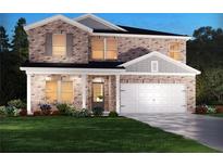 Beautiful two-story brick home featuring a manicured lawn, two-car garage, and inviting covered front entry at 7761 Halifax Way, Fairburn, GA 30213