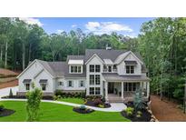Stunning two-story home with a well-manicured lawn and a walkway leading to the front porch at 1084 Wrights Mill Rd, Canton, GA 30115