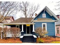 Charming blue two-story home with inviting front porch and manicured landscaping at 744 Oakland Se Ave, Atlanta, GA 30315