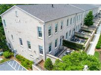 Rear exterior shot highlighting patios and multi-story structure at 3481 Landen Pine Ne Ct, Atlanta, GA 30305