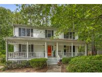 Charming two-story home featuring a welcoming front porch and well-maintained landscaping at 1519 Brookcliff Cir, Marietta, GA 30062