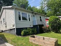 Charming single-story home with light-colored siding and a well-maintained front yard at 286 Booker Sw St, Atlanta, GA 30315