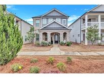 Charming home featuring a stone-accented front porch, well-maintained landscaping, and a welcoming entryway at 4658 Electric Sw Ave, Mableton, GA 30126